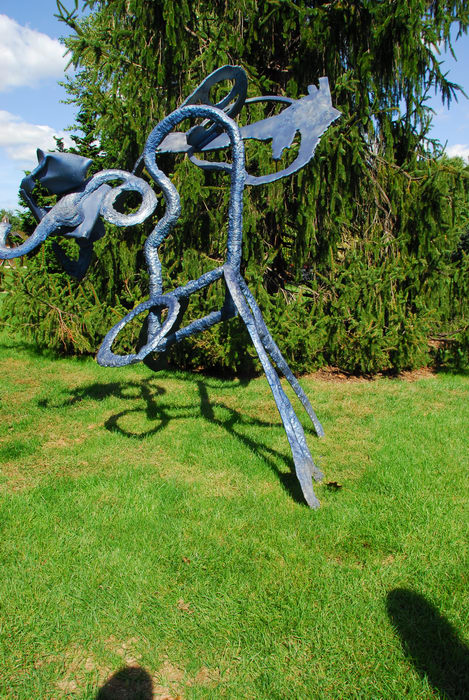 Sculptures, blue sky, grass, trees