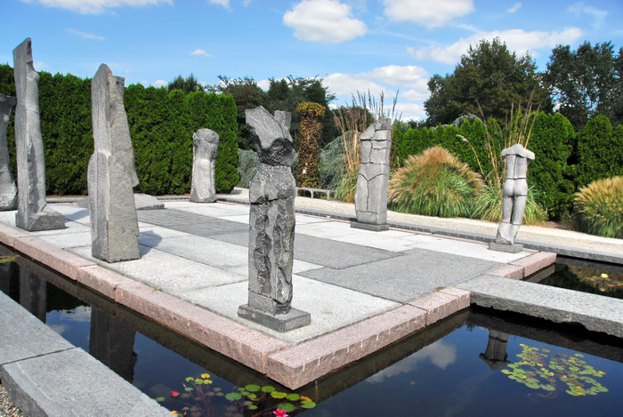 Sculptures, blue sky, marble, trees, water