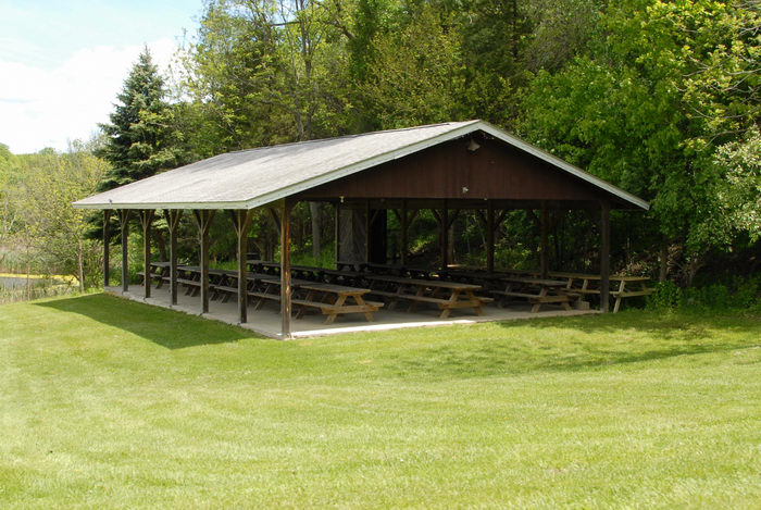 grass, picnic shelter, picnic tables, trees