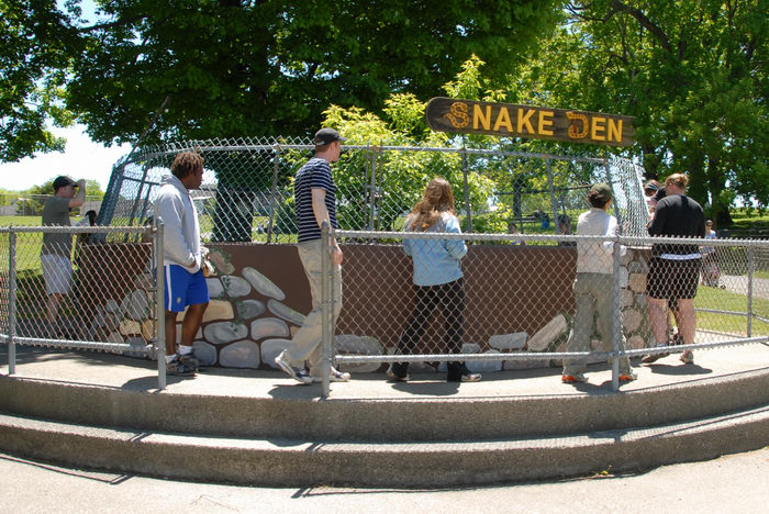 Jackie, Pam, Rob, cage, fence, grass, sign, snake den, trees