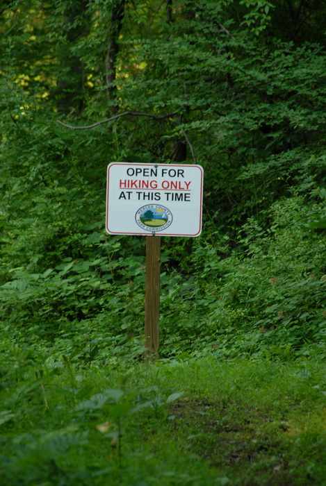 ground cover, hiking only sign, sign