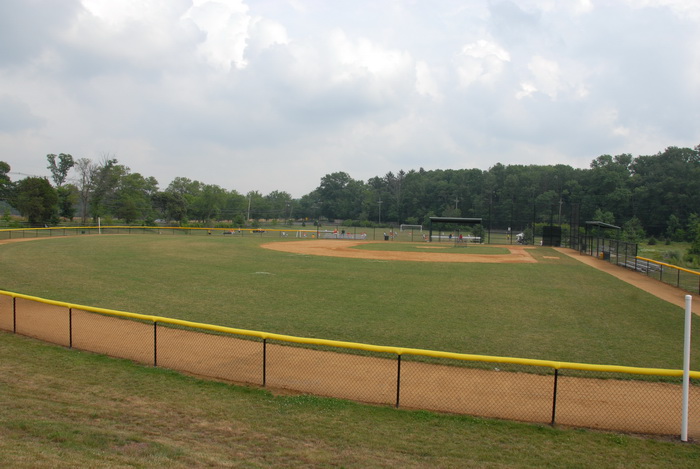 baseball field, fence, grass, clouds
