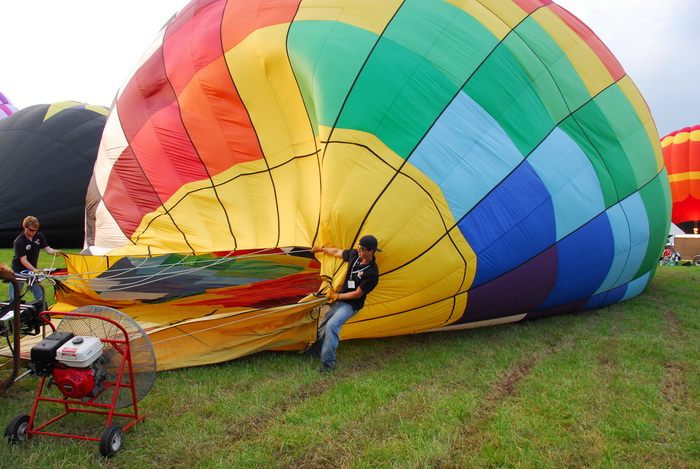 hot air balloon, inflating, people, workers, blowing up, fan