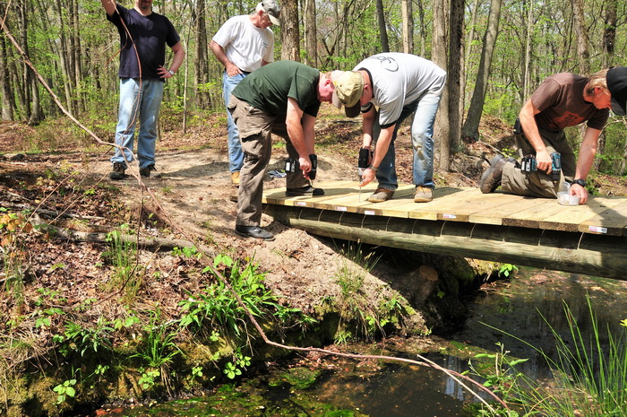 bridge, building, planks, spring, stream, trail maintenance, trees, volunteer, water